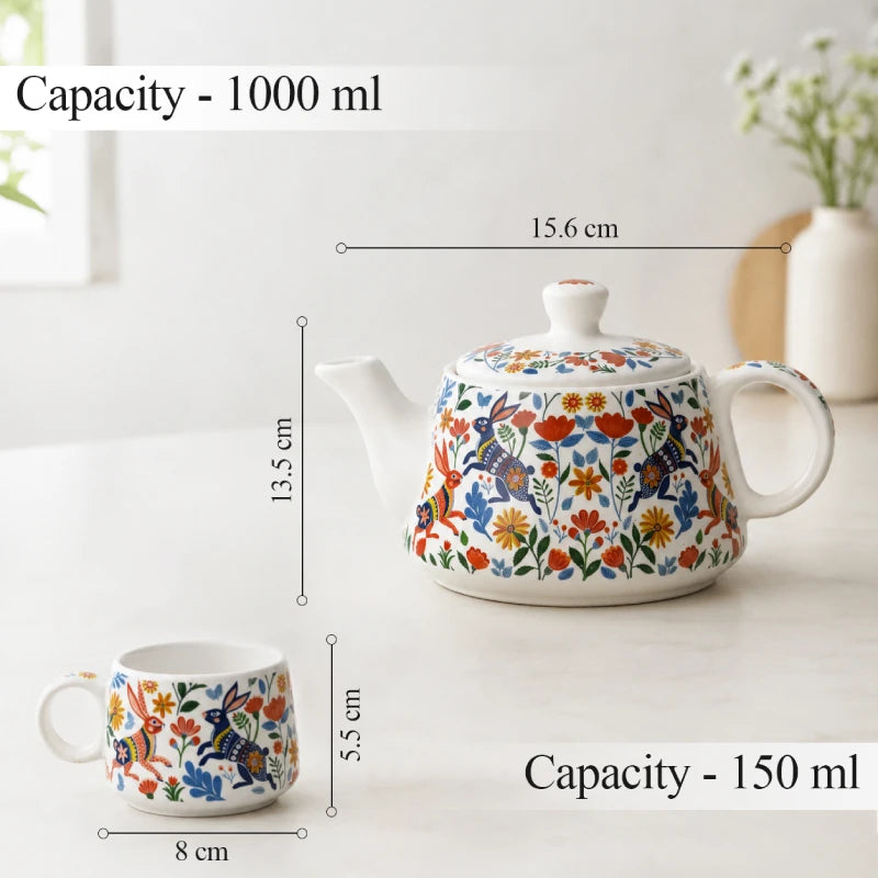 Ceramic teapot and mug with floral design, showing capacity and dimensions on a white background.