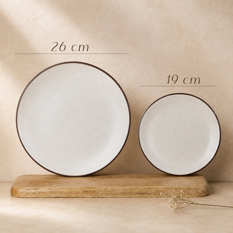 Two ceramic plates with measurements on a beige background